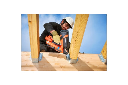A tradesman installing joist hangers using the Paslode PPNXi Cordless Nail Gun.