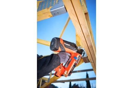 A tradesman installing joist hangers using the Paslode PPNXi Cordless Nail Gun.